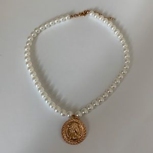 pearl necklace with gold coin pendant